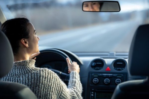 happy-young-woman-drives-car-inside-view_169016-17988